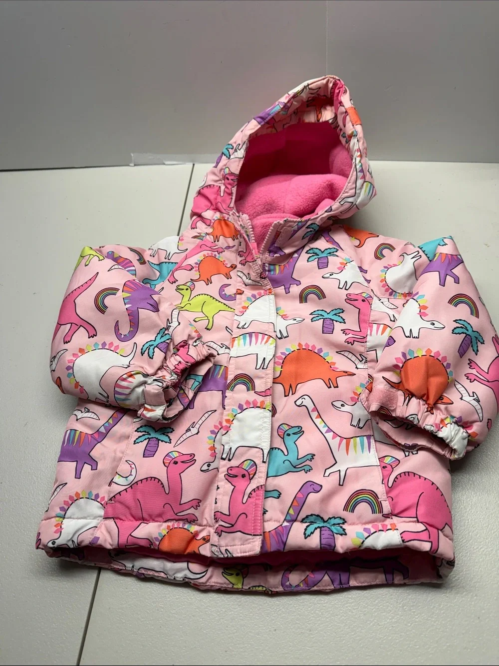 The Children's Place Pink Hooded Puffer Jacket with Colorful Dino Print. Size 3T